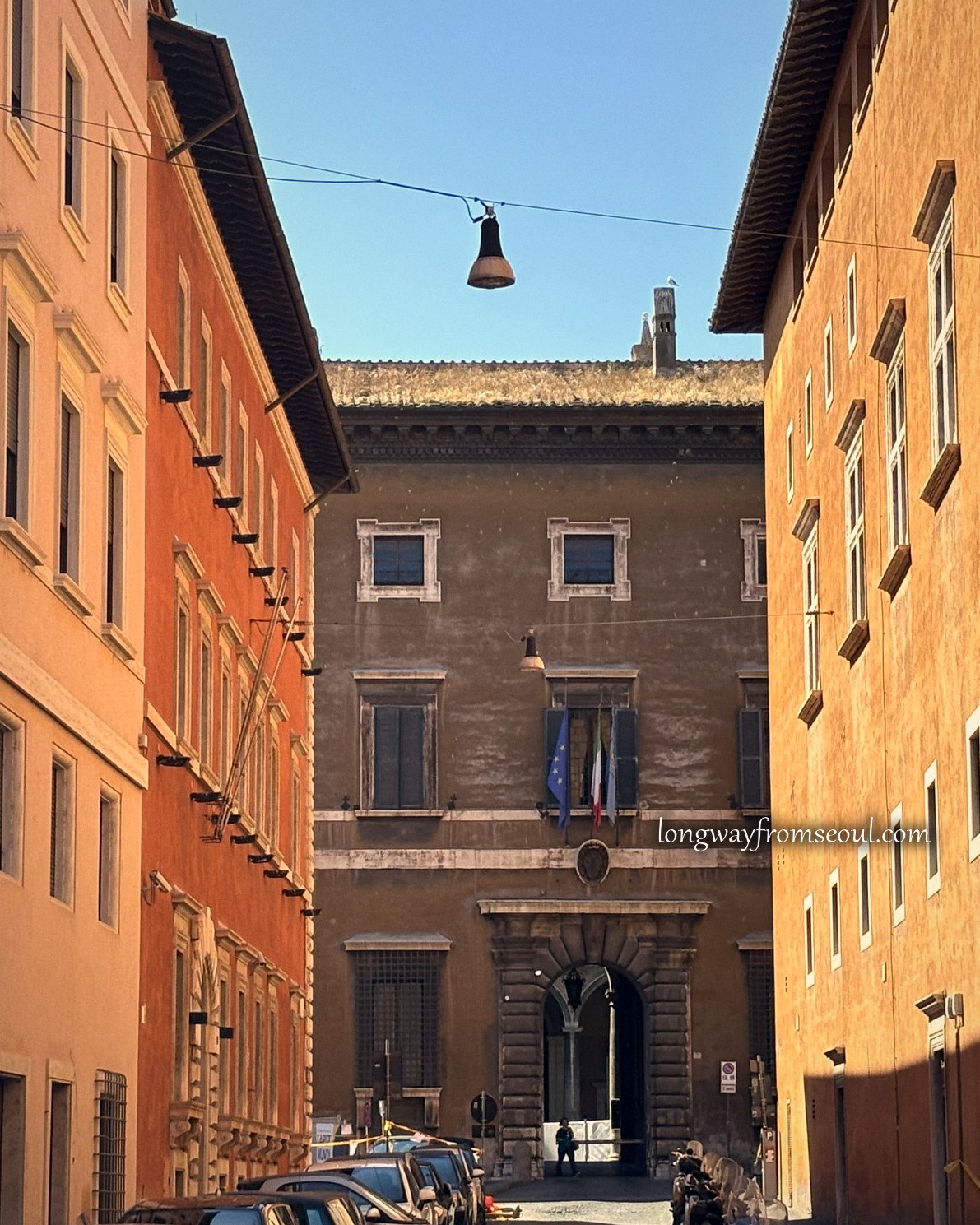 Ochre and terracotta buildings on a quiet street in Prati, Rome