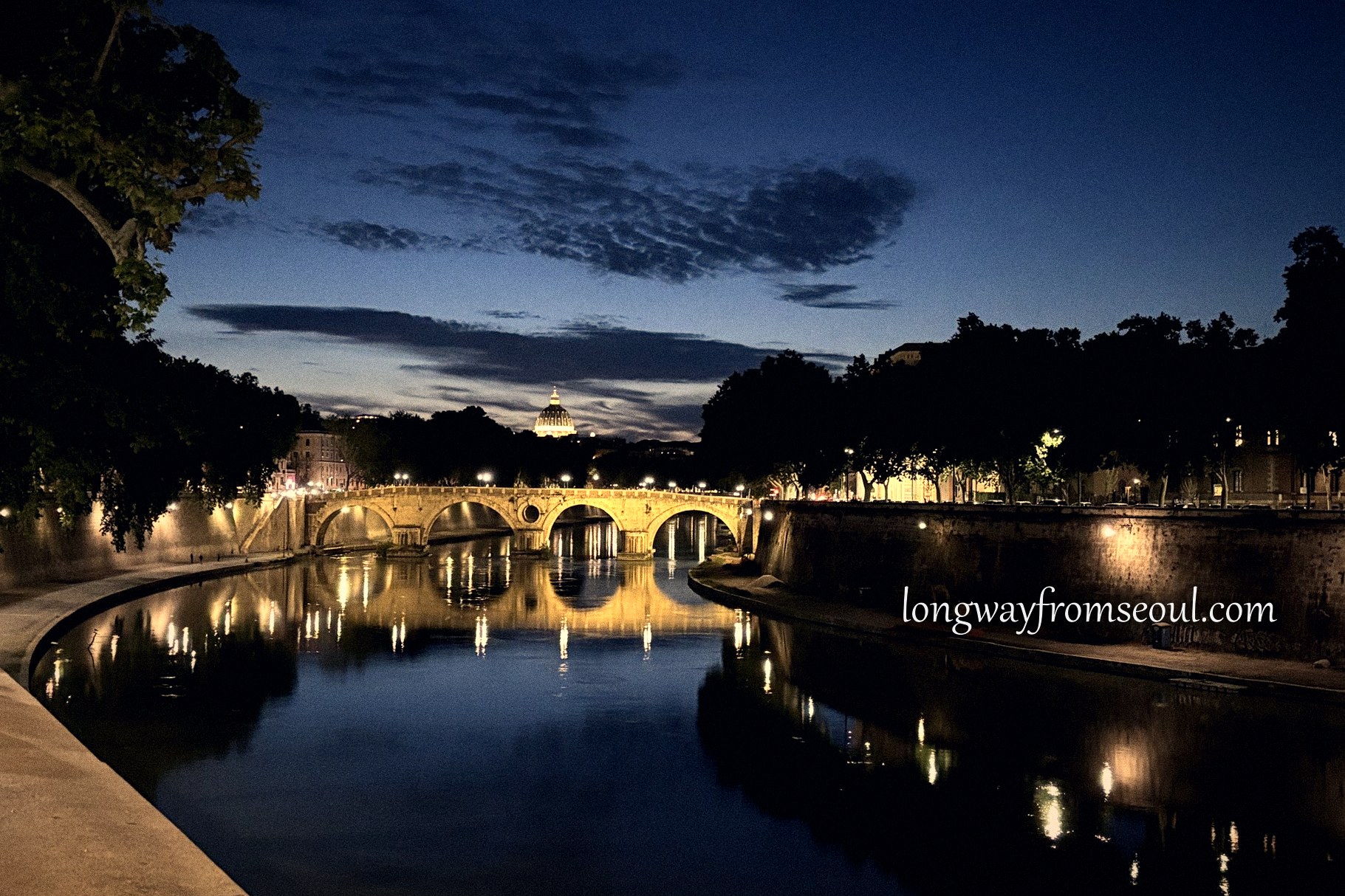 The Tiber and a lit bridge at blue hour, Rome