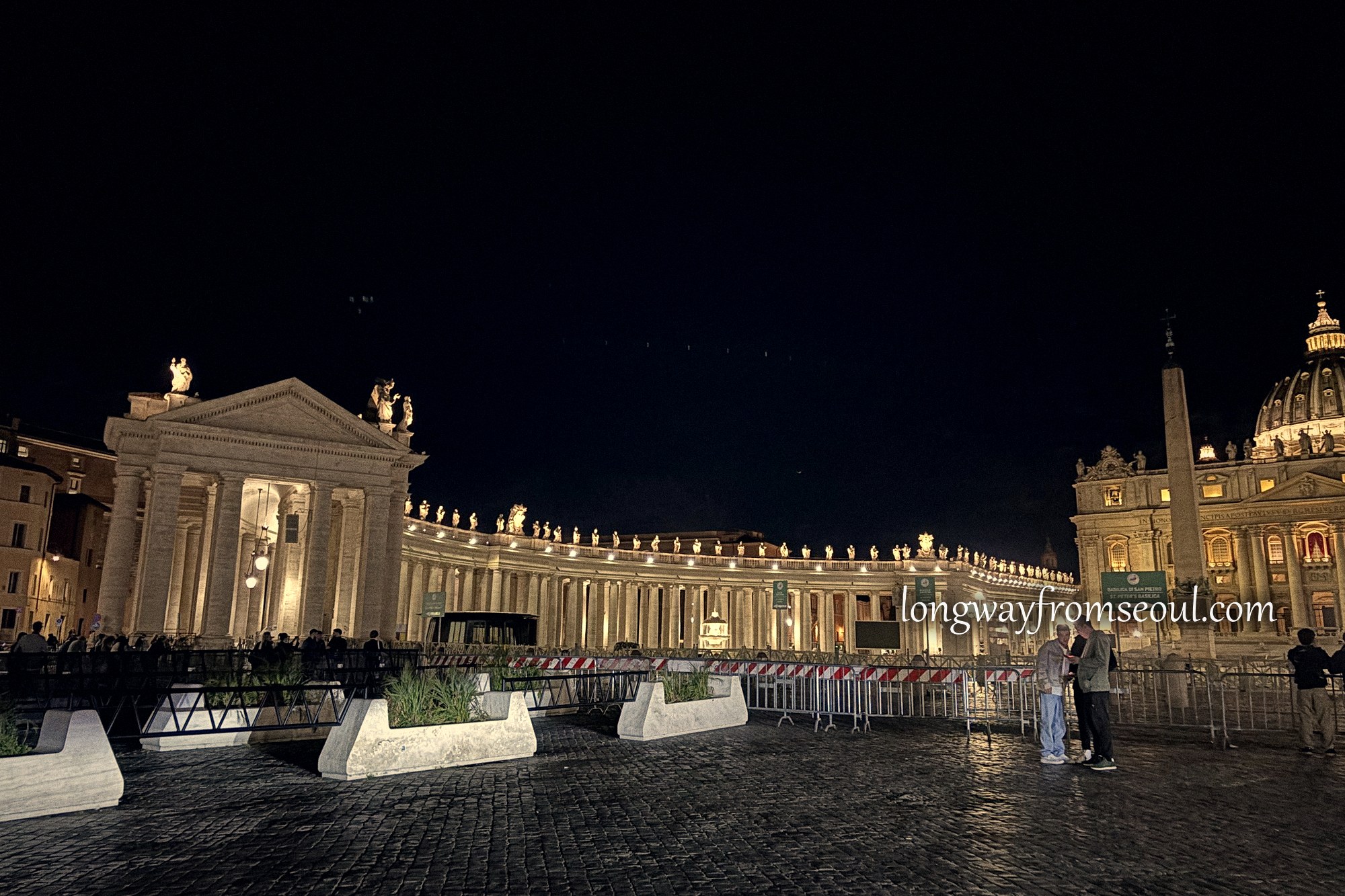 St Peter's Square lit up and almost empty at night