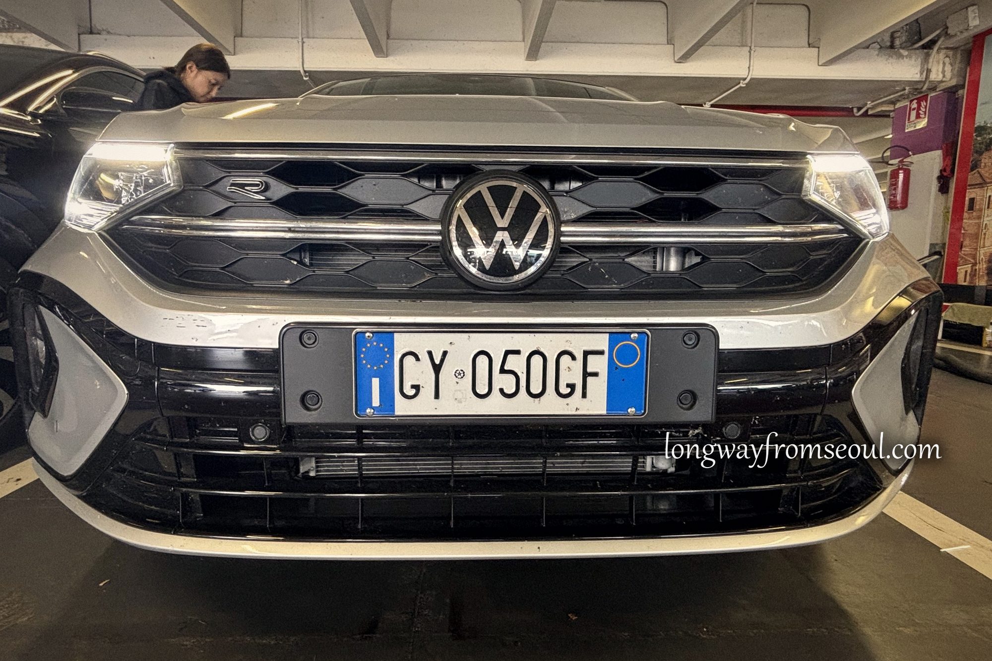 Front view of a silver Volkswagen Taigo rental car with Italian number plates