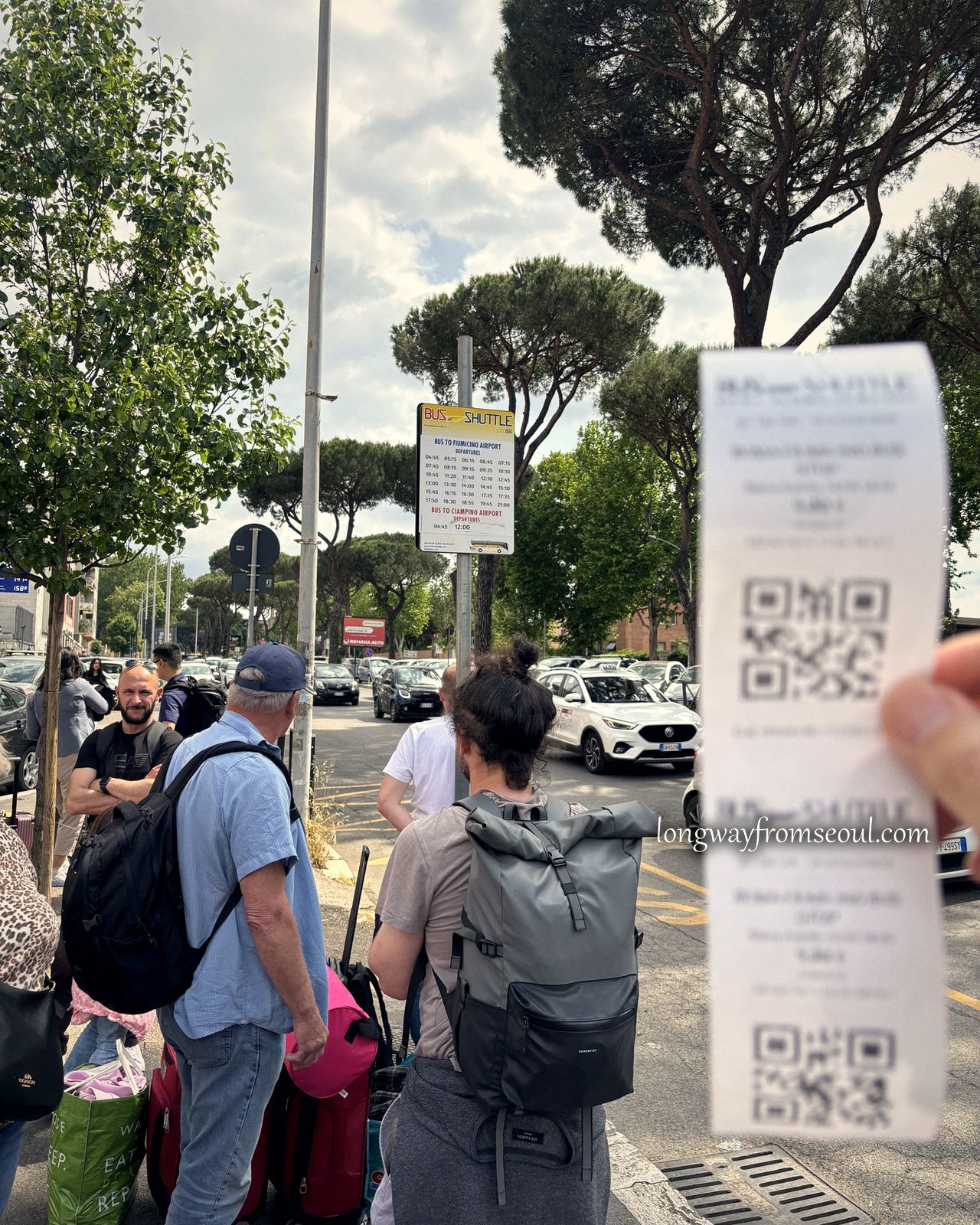 Travellers with backpacks and suitcases waiting for the airport shuttle bus in Rome